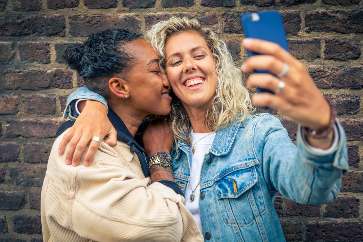 couple smiling and taking a selfie