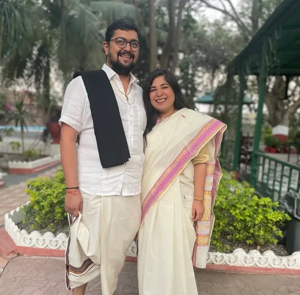 Viraj and Aakriti standing with big smiles