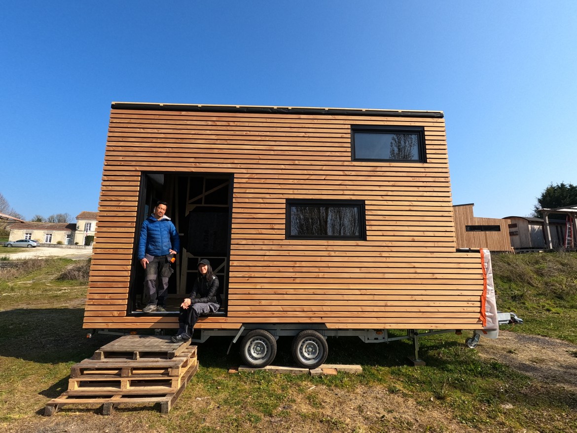 Carène and You-Liang in their tiny house that they build together. 